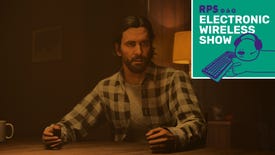 Alan Wake sits at a table, looking shocked, in Alan Wake 2. The Electronic Wireless Show logo is added in the top-right corner.