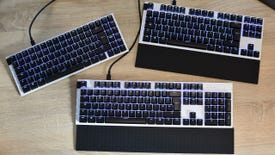 The NZXT Function full-size, tenkeyless and mini-TKL gaming keyboards on a desk.