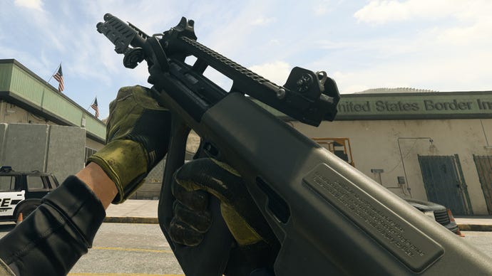 The player in Warzone 2.0 inspects their weapon, the HCR-56.