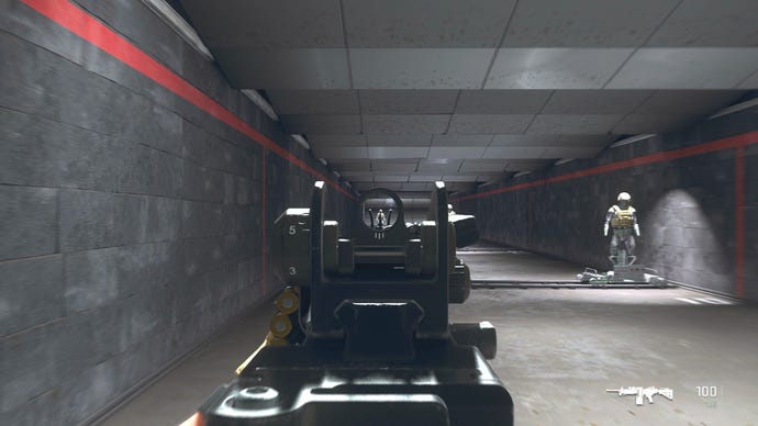 The player in Warzone 2.0 aims at a training dummy with the Sakin MG38 ironsights.